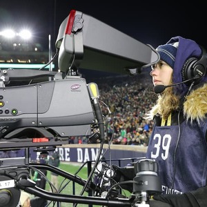 Nds Student Looking Through Camera At Football Game
