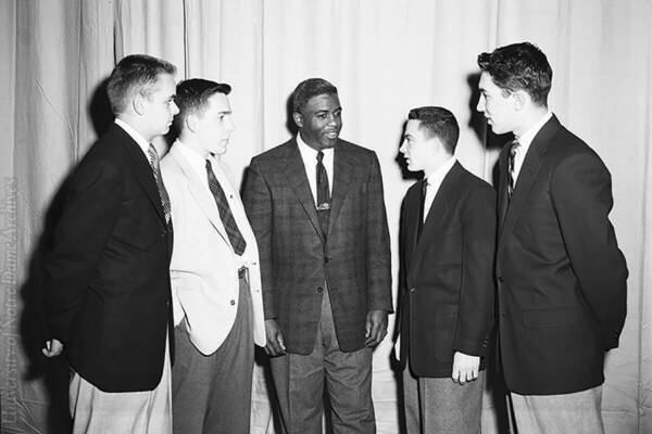 Jackie Robinson with students, 1954