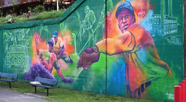 This mural of the Foundry Giants, featuring Alonzo Poindexter and John “Big Pitch” Williams, was painted by Thomas “Detour” Evans.